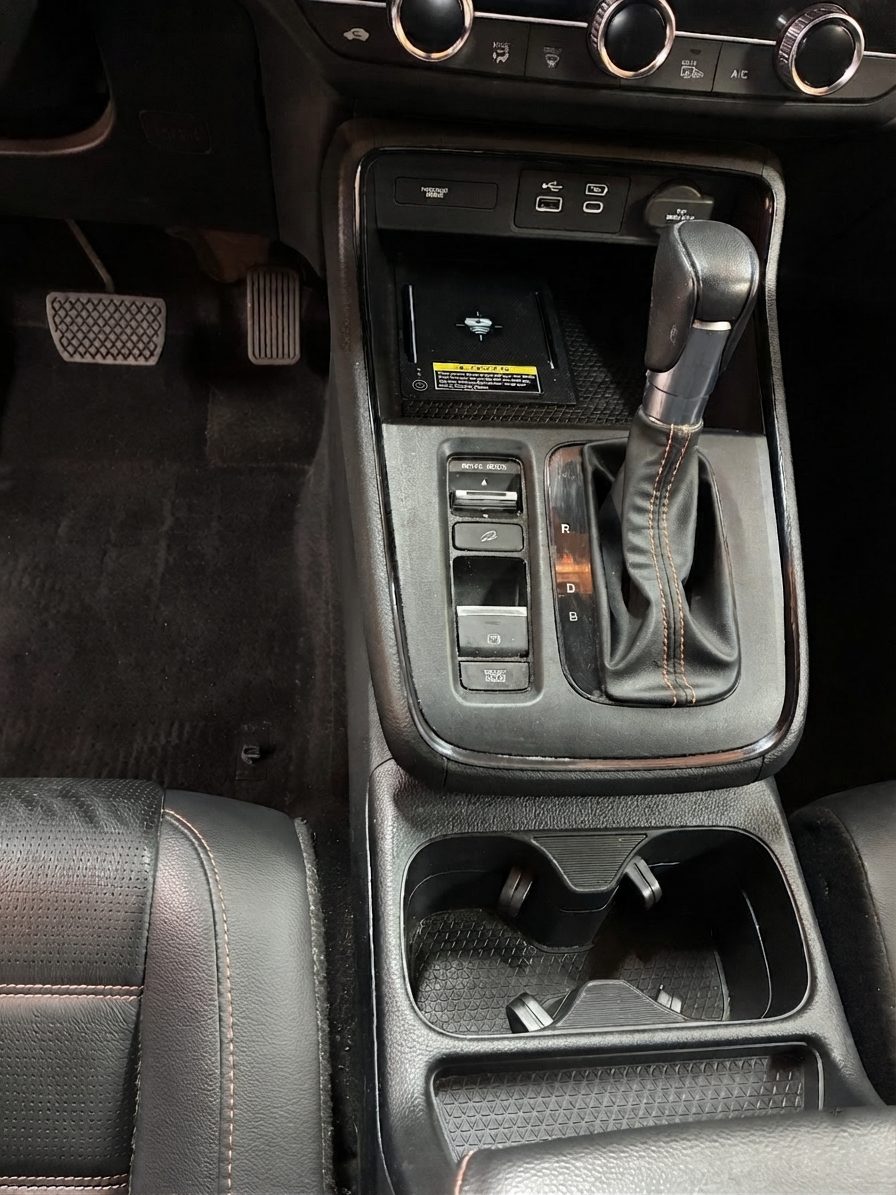 Vehicle center console after detailing by Lucke Touch