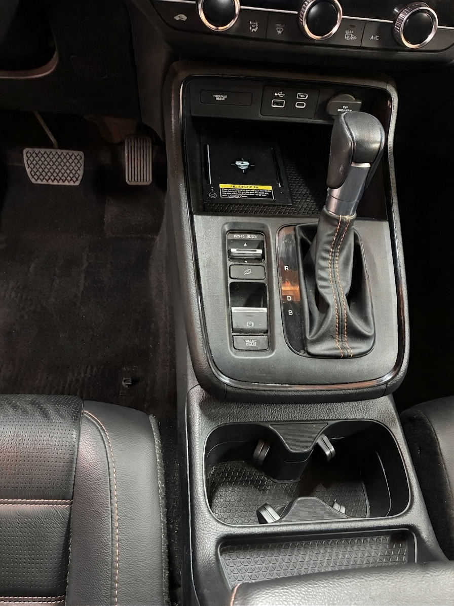 Vehicle center console after detailing by Lucke Touch